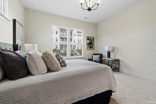 138 Parkerwood Ln, West Lafayette, IN 47906 - bedroom with baseboards, a notable chandelier, and carpet flooring