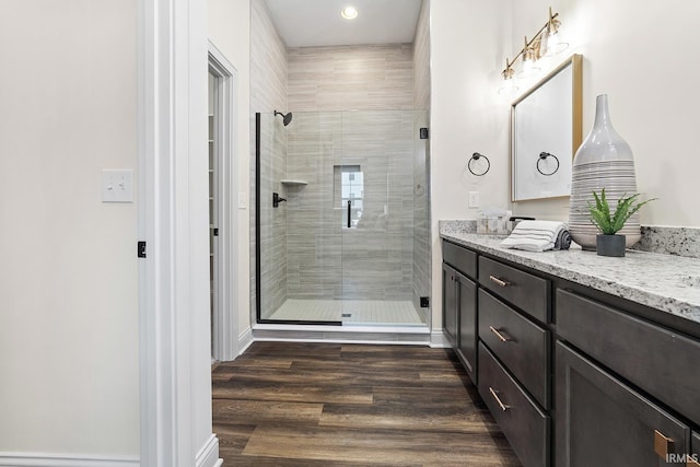 138 Parkerwood Ln, West Lafayette, IN 47906 - bathroom featuring recessed lighting, vanity, a stall shower, baseboards, and wood finished floors