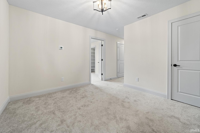 138 Parkerwood Ln, West Lafayette, IN 47906 - empty room featuring baseboards, visible vents, a textured ceiling, and carpet flooring