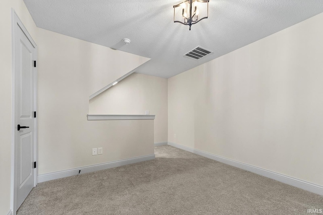 138 Parkerwood Ln, West Lafayette, IN 47906 - additional living space featuring a textured ceiling, visible vents, baseboards, and carpet floors