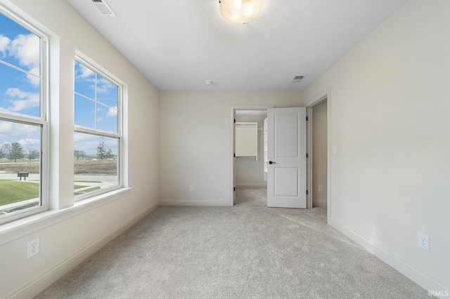 138 Parkerwood Ln, West Lafayette, IN 47906 - unfurnished bedroom with carpet flooring, visible vents, multiple windows, and baseboards