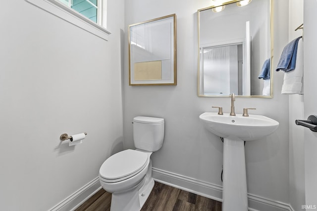 138 Parkerwood Ln, West Lafayette, IN 47906 - half bath featuring baseboards, wood finished floors, toilet, and a sink
