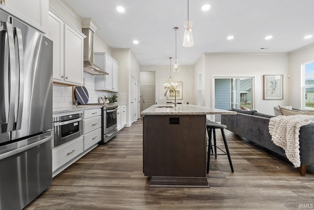 138 Parkerwood Ln, West Lafayette, IN 47906 - kitchen featuring decorative backsplash, appliances with stainless steel finishes, wall chimney range hood, a sink, and open floor plan