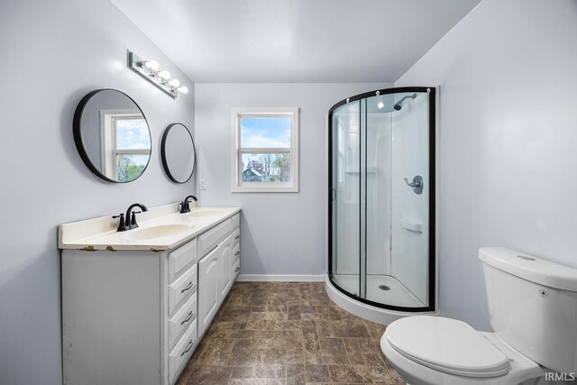 601 W Sherman St, Windfall, IN 46076 - bathroom with a wealth of natural light, toilet, a shower stall, and a sink