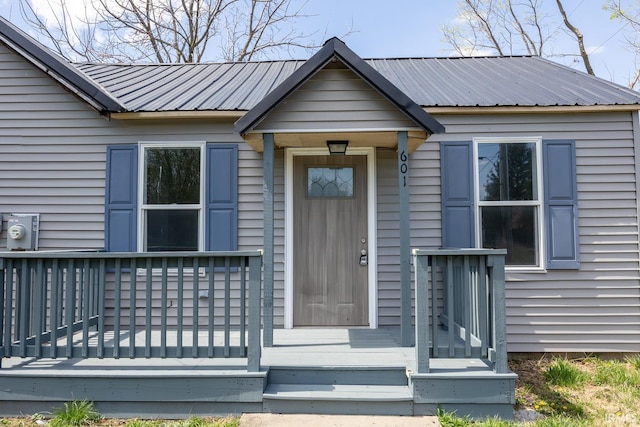 601 W Sherman St, Windfall, IN 46076 - view of exterior entry with a deck and metal roof