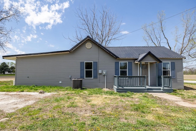 601 W Sherman St, Windfall, IN 46076 - ranch-style home with metal roof, cooling unit, and covered porch