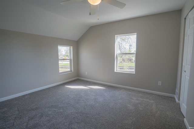 additional living space featuring baseboards, ceiling fan, carpet flooring, and vaulted ceiling