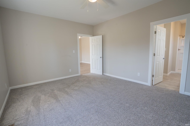 unfurnished bedroom featuring ceiling fan, carpet flooring, and baseboards