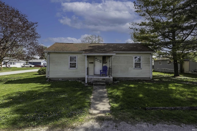 121 E Water St, Linden, IN 47955 - bungalow-style home with a front yard and roof with shingles