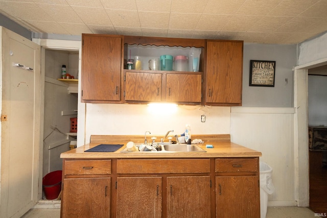 121 E Water St, Linden, IN 47955 - kitchen with brown cabinetry, open shelves, light countertops, and a sink