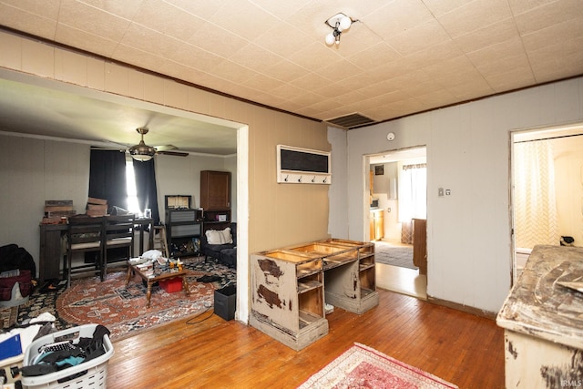 121 E Water St, Linden, IN 47955 - living area featuring ornamental molding, ceiling fan, and hardwood / wood-style flooring