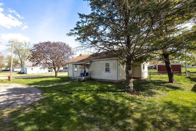 121 E Water St, Linden, IN 47955 - back of house with a lawn and fence