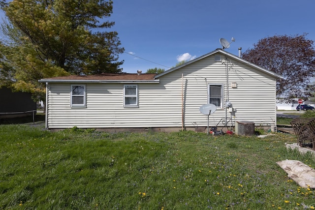 121 E Water St, Linden, IN 47955 - back of property featuring a lawn, crawl space, and central AC unit