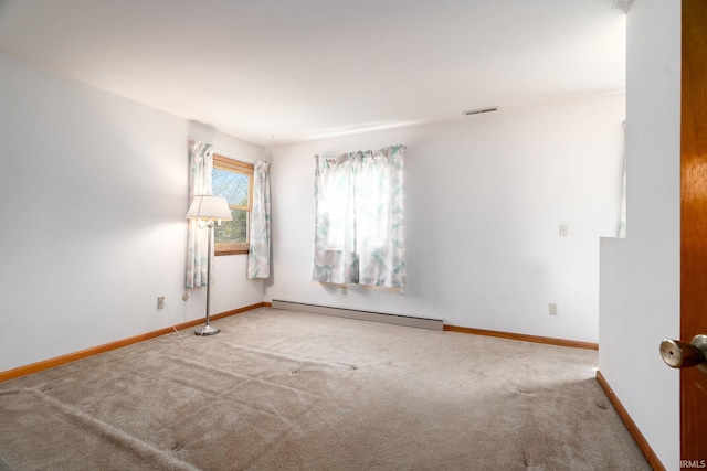 unfurnished room with a baseboard radiator, visible vents, carpet flooring, and baseboards