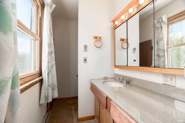 bathroom featuring vanity and baseboards