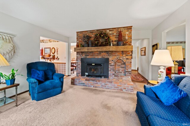 carpeted living area with baseboards
