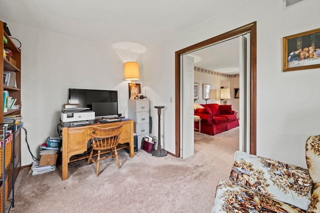 office space featuring visible vents, carpet floors, and baseboards