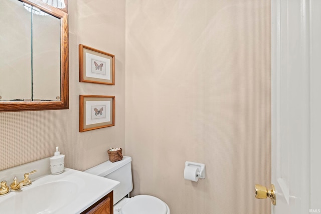half bath with toilet and vanity
