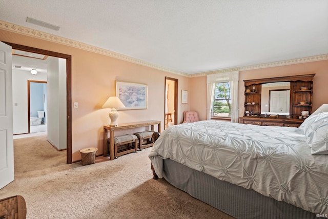 bedroom with carpet flooring and visible vents