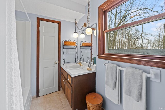 full bathroom featuring vanity, shower / bath combination with curtain, and tile patterned flooring