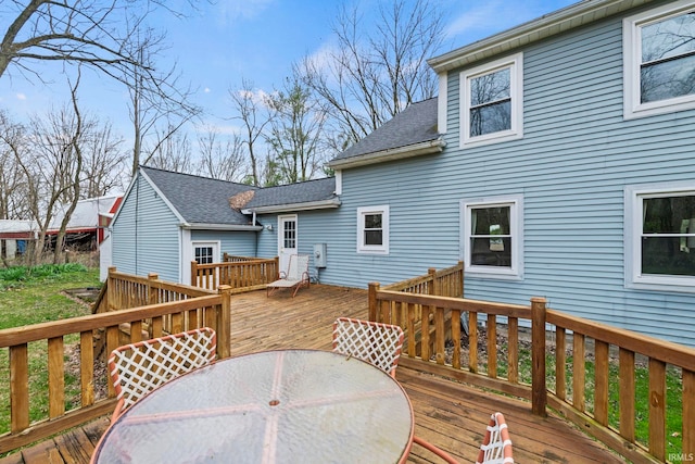 wooden deck with outdoor dining space