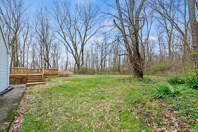 view of yard with a wooden deck
