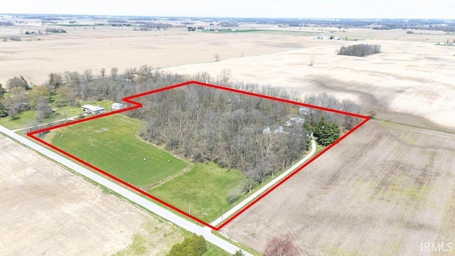 birds eye view of property featuring a rural view