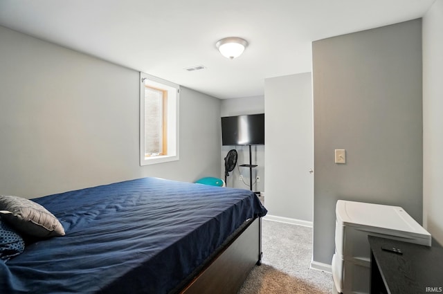 bedroom featuring carpet floors and baseboards