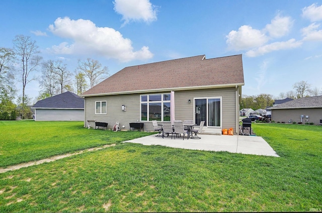back of house featuring a lawn and a patio