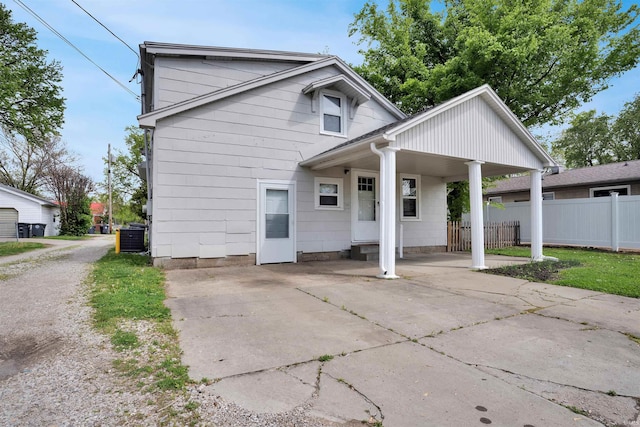 314 S Welworth Ave, Evansville, IN 47714 - exterior space with fence, driveway, central air condition unit, and an attached carport