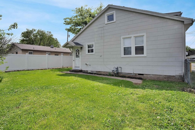 314 S Welworth Ave, Evansville, IN 47714 - rear view of property featuring a yard, crawl space, and a fenced backyard