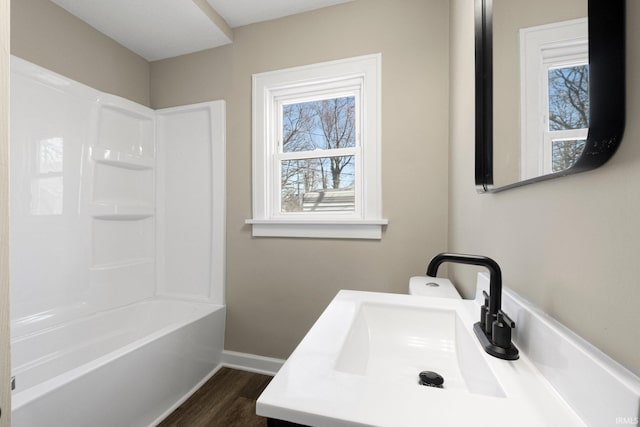 4121 Smith St, Fort Wayne, IN 46806 - full bath featuring shower / bathing tub combination, wood finished floors, vanity, and baseboards