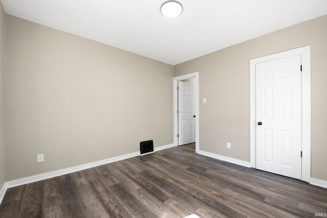 4121 Smith St, Fort Wayne, IN 46806 - spare room with dark wood-style floors, visible vents, and baseboards
