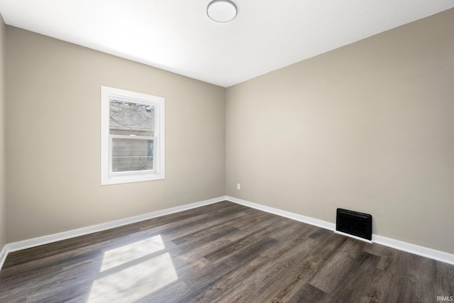 4121 Smith St, Fort Wayne, IN 46806 - unfurnished room with visible vents, dark wood-style floors, and baseboards