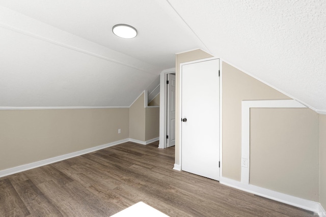4121 Smith St, Fort Wayne, IN 46806 - bonus room featuring lofted ceiling, wood finished floors, and baseboards