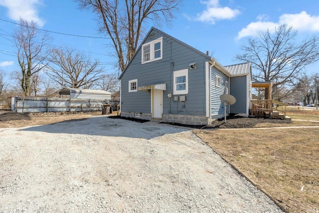 4121 Smith St, Fort Wayne, IN 46806 - exterior space with metal roof, driveway, and fence