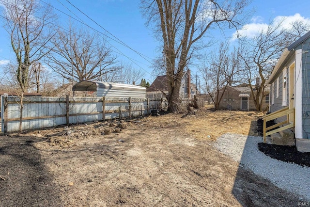4121 Smith St, Fort Wayne, IN 46806 - view of yard featuring a detached carport and fence