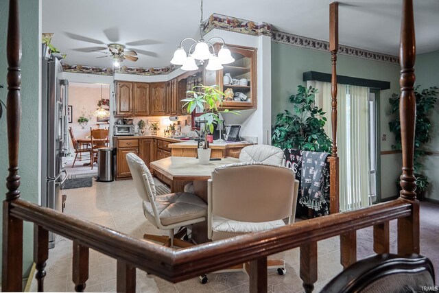 dining room featuring light tile patterned flooring, ceiling fan, and a toaster