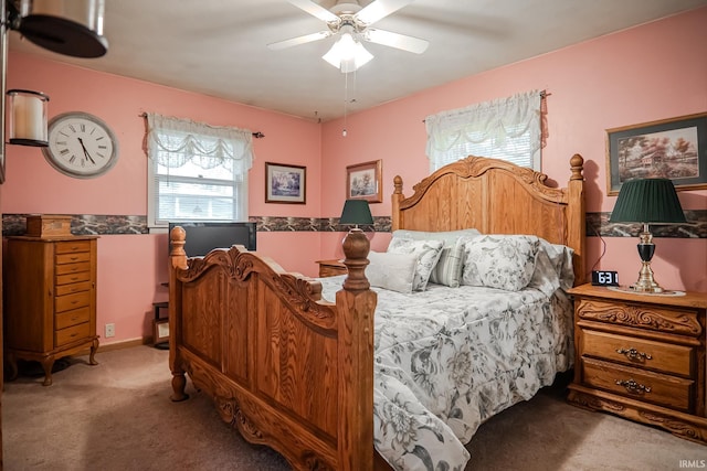 bedroom with ceiling fan and carpet