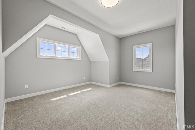 12274 Rain Lily Ct, Fort Wayne, IN 46814 - bonus room featuring carpet floors, baseboards, and visible vents