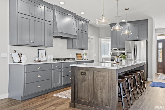 12274 Rain Lily Ct, Fort Wayne, IN 46814 - kitchen with a sink, wood finished floors, and gray cabinetry