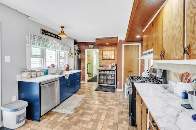 719 E Mitchell St, Kendallville, IN 46755 - kitchen featuring appliances with stainless steel finishes, under cabinet range hood, brick wall, brick patterned floor, and blue cabinets