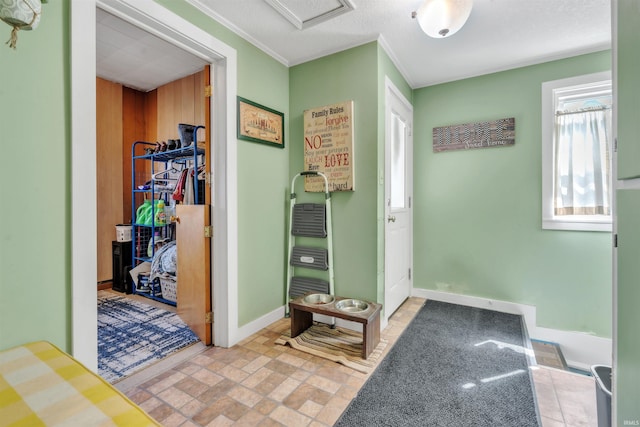 719 E Mitchell St, Kendallville, IN 46755 - interior space with wood walls, crown molding, and baseboards