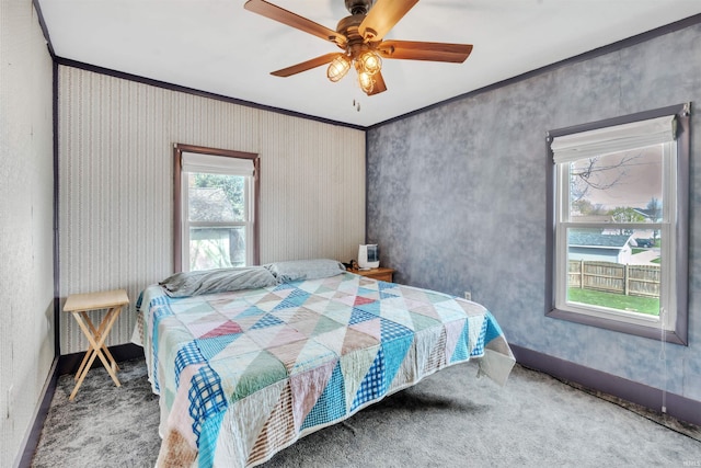 719 E Mitchell St, Kendallville, IN 46755 - carpeted bedroom with baseboards, a ceiling fan, and crown molding