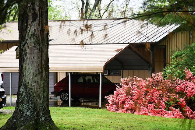 exterior space featuring a lawn and a carport