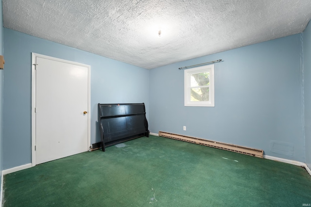 unfurnished bedroom featuring baseboards, a baseboard heating unit, carpet floors, and a textured ceiling