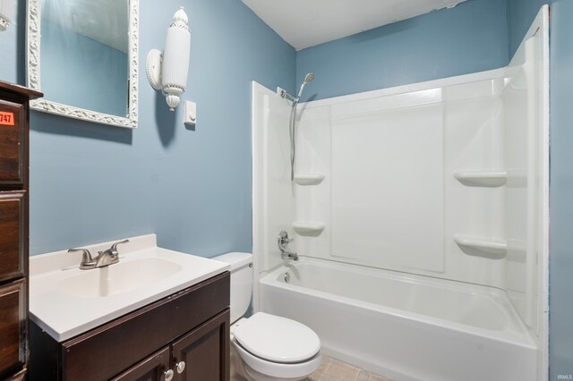 bathroom featuring vanity, toilet, and bathing tub / shower combination