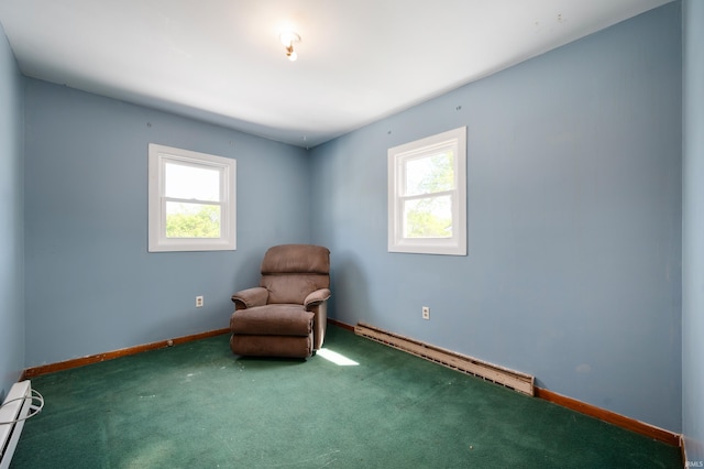 unfurnished room with baseboard heating, a healthy amount of sunlight, carpet flooring, and a baseboard radiator