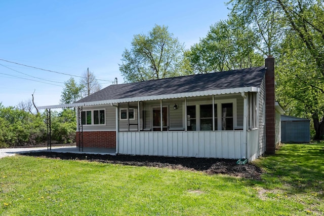 bungalow with a porch, a front lawn, roof with shingles, and a chimney