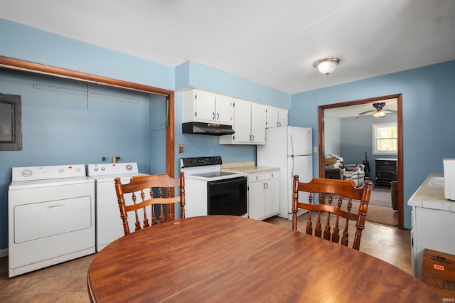 kitchen with white cabinets, freestanding refrigerator, under cabinet range hood, electric range oven, and washer and clothes dryer